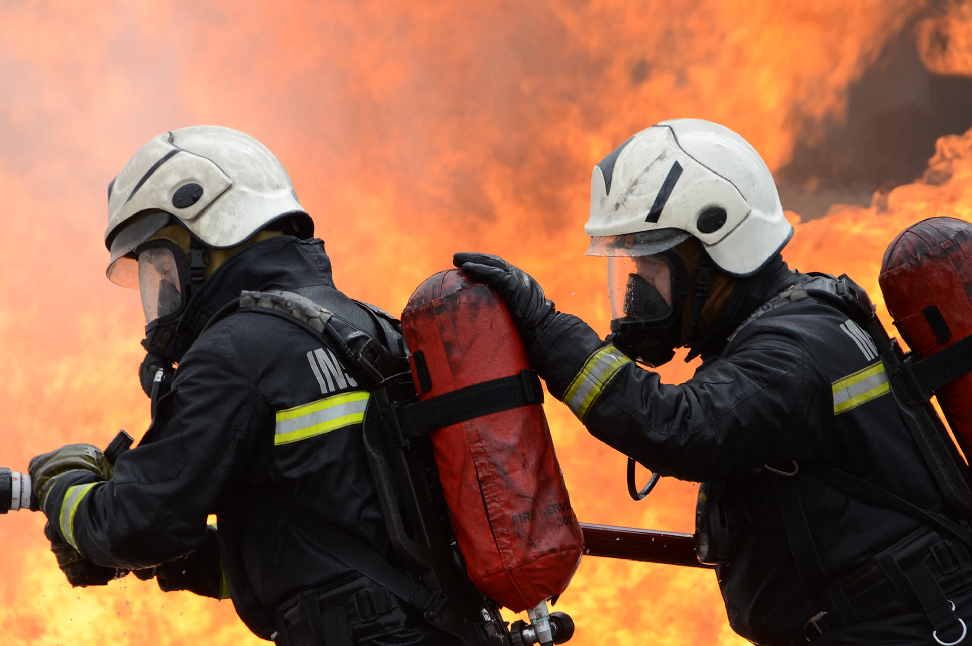 Delegates with fire house live fire training